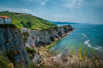 Photo of the bluff in Getaria, Spain stretching into the ocean.
