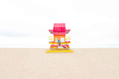 A washed out picture of a lifeguard tower on a beach giving a dreamy feel.