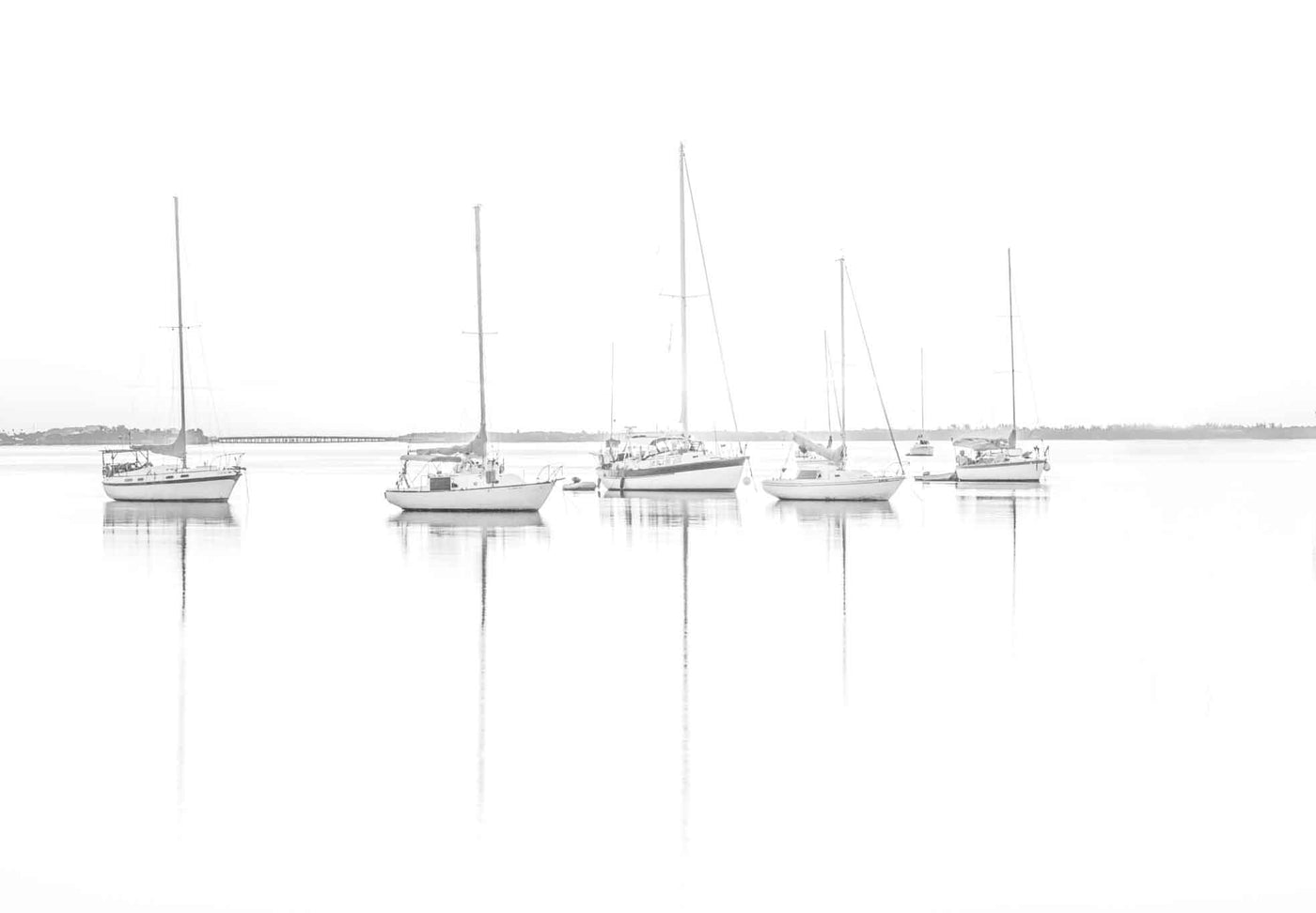 A high key image at Buscayne Bay with saliboats moored in the water.